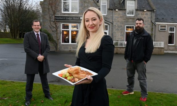Aimee Reid, Mark McDonald and Evan Adamson from Aberdeen charity Instant Neighbour have helped deliver Christmas meals.