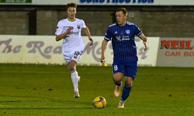 Scott Brown, right, in action for Peterhead prior to the shutdown of lower league football.