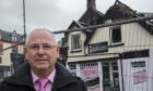 Barber John Wilson whose shop was devastated by a fire
