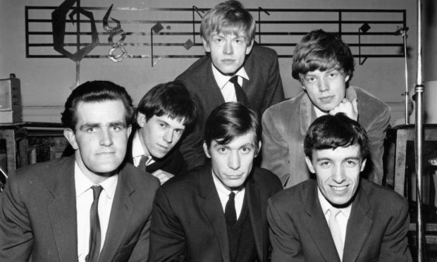 The Rolling Stones with Ian Stewart on the far left.