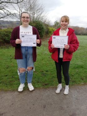 Jade Allan and Kirsty Arnaud, activists in the group Stand Up i Pefferside Park, Dingwall, supporting the global campaign against gender-based violence