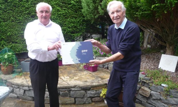 John MacKenzie, chairman of Badeoch Shinty Memories (left) and Donnie Grant, Shinty Memories ambassador