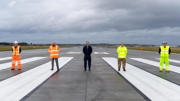 Runway resurfacing works have been completed at RAF Lossiemouth. Pictured: Keith Mablethorpe, VolkerFitzpatrick Project Director, Russ Liddington, DIO Project Manager, Wing Commander James Ash, RAF Lossiemouth, Wing Commander Pete Beckett, Lossiemouth Development Project, Andy Reynolds, VolkerFitzpatrick Operations Manager.