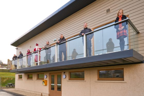 Pictured: John Thomson, Chris Muir, Olivia Rodger, Santa aka James Wilson, Alastair Kennedy, George Cowie, John Tulloch and Carol Lennon.