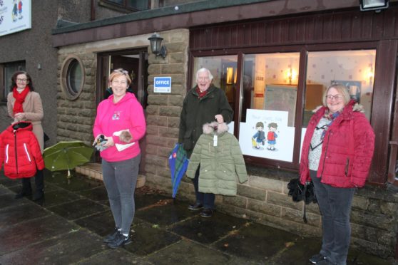 The Moray Emergency Relief Fund recently donated £5,000 to Moray School Bank. Pictured: Moray Vice Lord Lieutenant Nancy Robson, Moray School Bank development coordinator Debbie Kelly, Moray Lord Lieutenant Seymour Monro, Moray School Bank development manager Debi Weir.