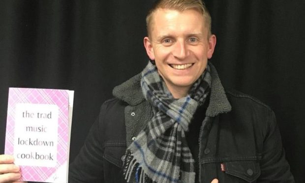 Martin Gillespie from Skerryvore with the cookbook.