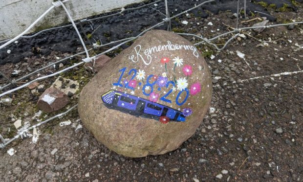 Pictures of tributes at the Carmont signal box.