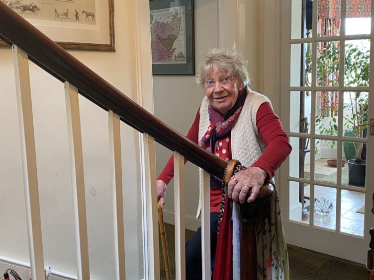 Margaret Payne at the foot of her stairs in Ardvar, Sutherland.
