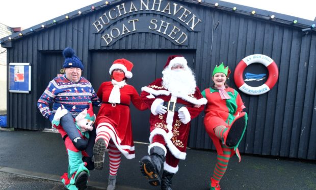 Father Christmas with helpers, Alex Donaldson, Jill Donaldson and Sarah Donaldson at Buchanhaven Boat Shed.