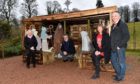 From left: Anne Harrison (session clerk), Euan Glen (Minister) with Lynda and Scott Langlands at their nativity scene barn at Cluny Parish Church, Inverurie.