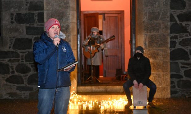 The doorstep caroling was organised to bring cheer to Fetterangus.