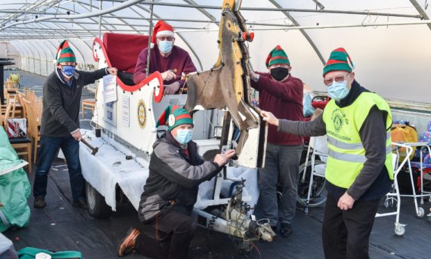 The Inverness Culloden Rotary Club are making final preparations ahead of their Santa Sleigh initiative which commences from Monday. 
Pictures by JASON HEDGES