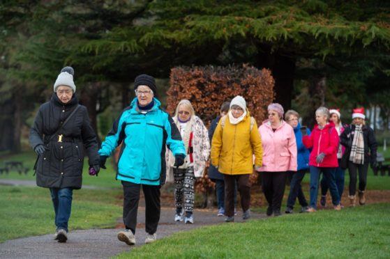 About 20 walkers joined the group in Elgin's Cooper Park.