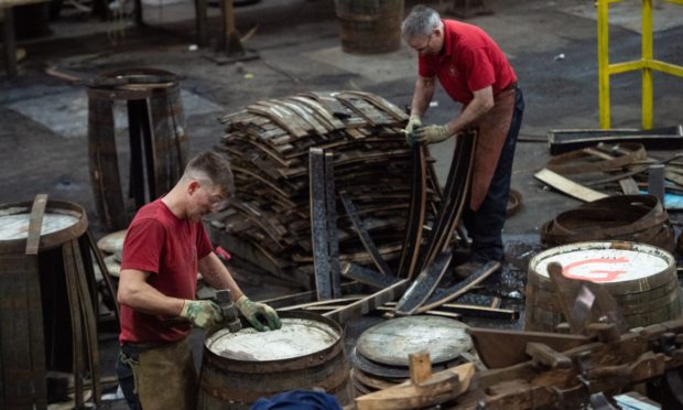 Coopers hard at work in Speyside Cooperage.