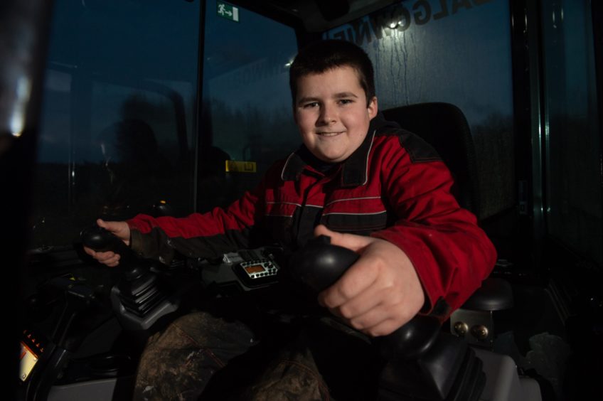 Jamie Currie, 13, at the controls.