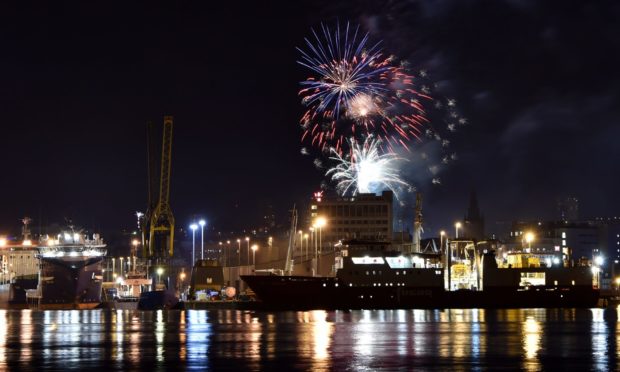 Aberdeen city centre Hogmanay party fireworks at His Majesty's Theatre as seen from the harbour in 2018.