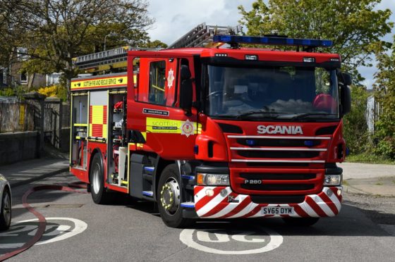 The Scottish Fire and Rescue Service has been paying Christmas visits to the children's hospital for several years. Picture by Kenny Elrick