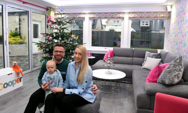 Mark and Ria Petrie with their son Cooper at their home in Echt