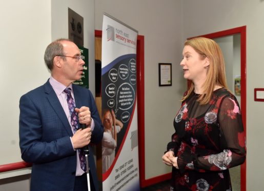 North East Sensory Services chief executive Graham Findlay meets social security secretary Shirley-Anne Somerville at the charity's Aberdeen base in St John Street earlier this year.
Picture by Scott Baxter