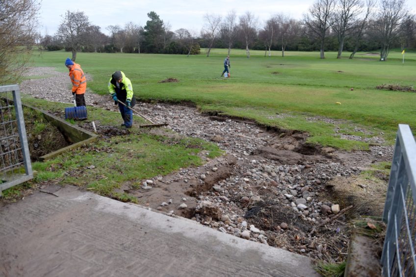 Clear up operations at Garmouth and Kingston Golf Club after the most recent flood.
