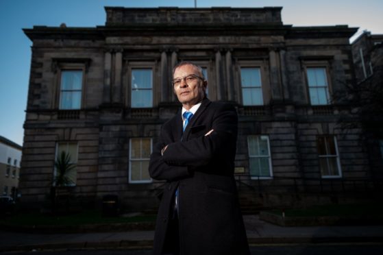 Former British Army soldier, Alan Duncan, pictured standing outside Elgin Sheriff Court.