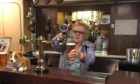 Agnes Flett, pouring a pint behind the bar of The Grill where she was a much-loved figure for 40 years.