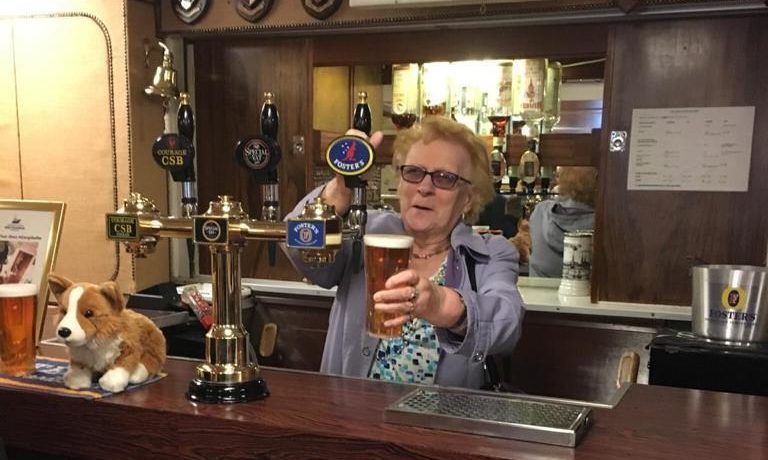Agnes Flett, pouring a pint behind the bar of The Grill where she was a much-loved figure for 40 years.