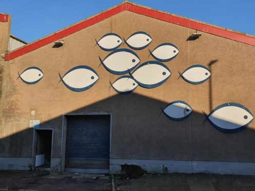Janine Ewen's photo of shadows cast against the mural on Couper's Seafood factory in Torry, which will feature in a National Portrait Gallery exhibition. Supplied by Janine Ewen