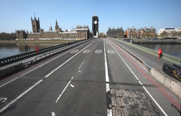 Westminster Bridge, next to the Houses of Parliament and Big Ben, is almost deserted during lockdown.