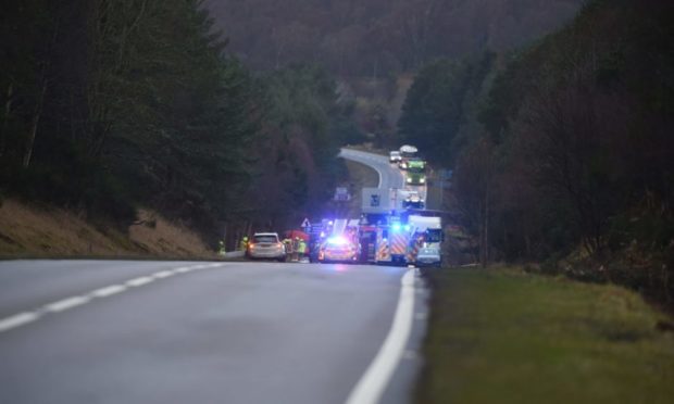 Emergency services at the scene of an accident on the A95 at Skye of Curr. Picture by Sandy McCook 01/12/2020.