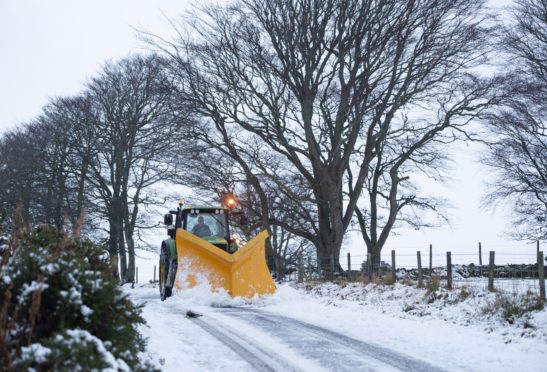 A plough clears snow near Cushnie in Aberdeenshire.
