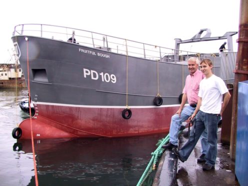 The late James West, with son Andrew and Fruitful Bough at Macduff Harbour in 2003.
Photo by Andrew Taylor, Banff.