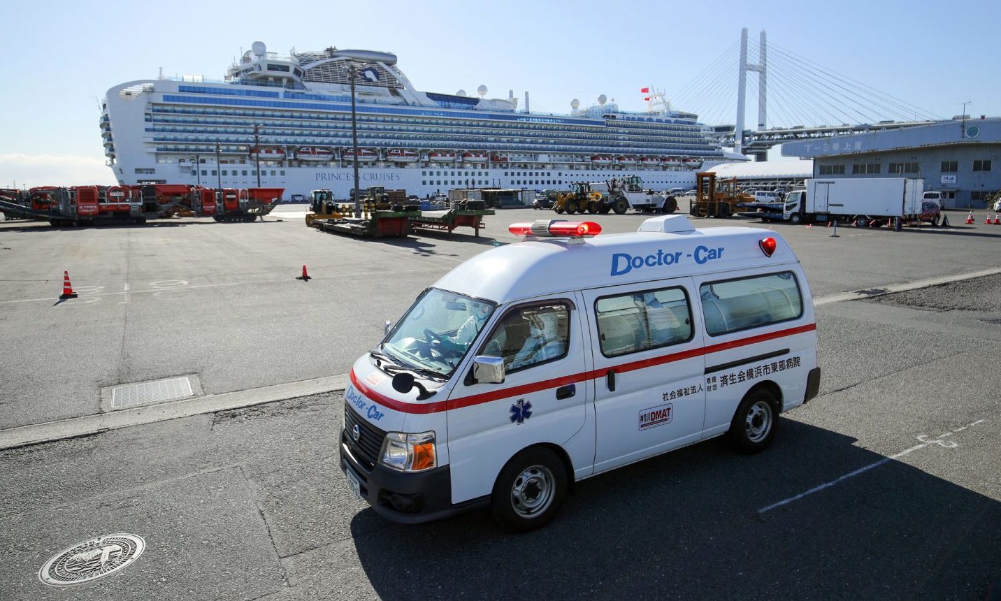 An ambulance believed to carry a Diamond Princess cruise ship passenger infected by the coronavirus leaves the Daikoku Pier Cruise Terminal in Yokohama, Tokyo.