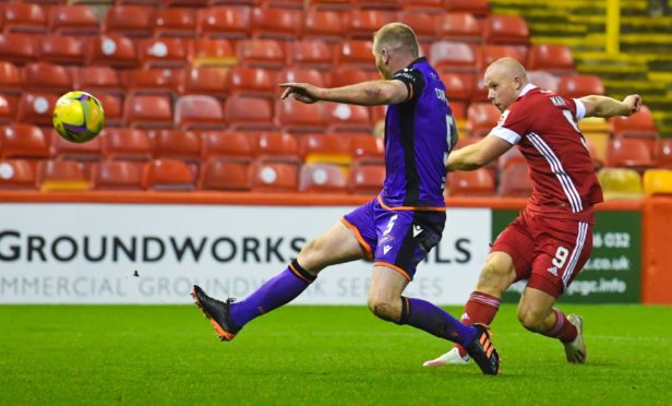 Aberdeen's Curtis Main shoots at goal.