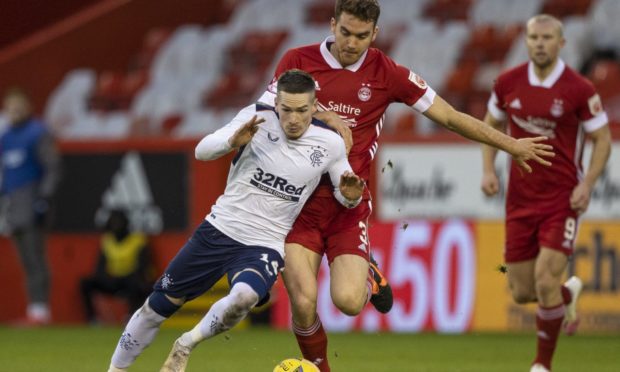 Rangers' Ryan Kent (left) tussles with Aberdeen's Tommie Hoban.