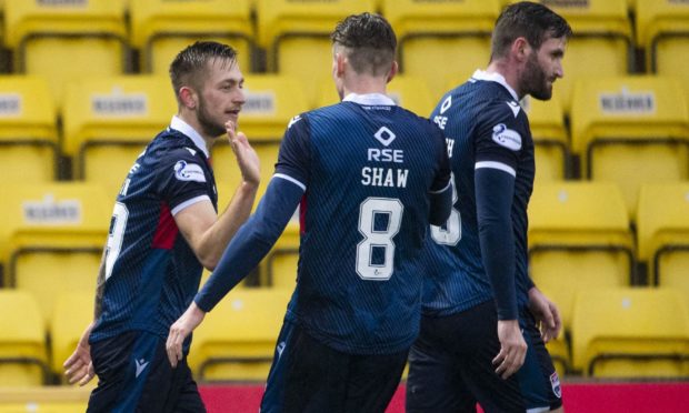 Charlie Lakin, left, celebrates netting for Ross County.