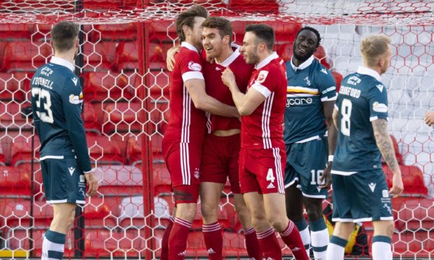 Aberdeen's Tommie Hoban (centre) celebrates scoring with Andy Considine and Ash Taylor.
