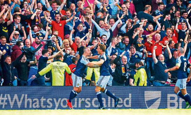 Scotland's Leigh Griffiths celebrates after scoring a free-kick to put his side ahead against England in 2017.