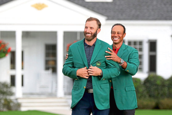 It's only been five months since 2019 Masters champion Tiger Woods, right, presented 2020 winner Dustin Johnson with the Green Jacket.