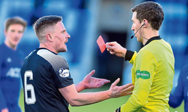 Peterhead's Simon Ferry is shown a red card against Cove Rangers. Picture by Chris Sumner