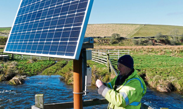 SAC technician Robert Richie working on the solar only system.