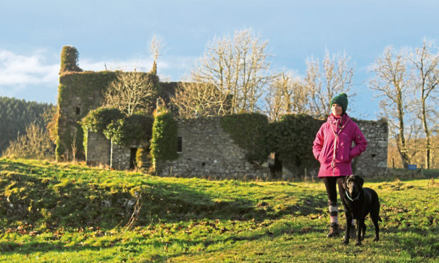Gayle Ritchie explores Gight Castle near Methlick in Aberdeenshire with her dog, Toby.