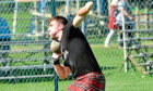 George Evans throws the 16lb stone at Aboyne Highland Games. Picture by Colin Rennie