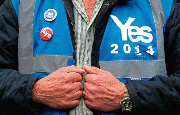 A march for 'devo max' powers in Glasgow, Scotland, following a No vote in the Scottish independence referendum. PRESS ASSOCIATION Photo. Picture date: Sunday October 19, 2014. The march took place in Glasgow to demand full devolved powers over tax revenues, social policy and government borrowing through negotiations of extra powers for Scotland. Photo credit should read: Danny Lawson/PA Wire