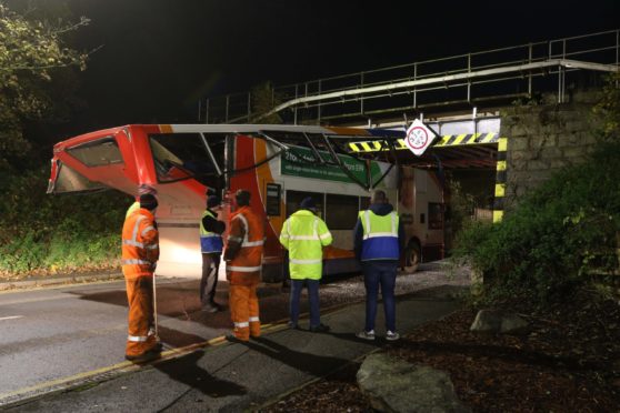 Rail services in and out of Inverness were disrupted in November 2019 after a Stagecoach double decker bus went under a low bridge on Harbour Road and sliced the top deck off. Nobody was injured in the crash. Picture by Andrew Smith