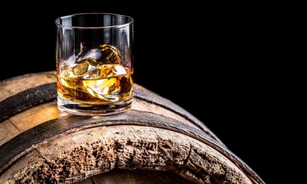 Whisky glass on cask.