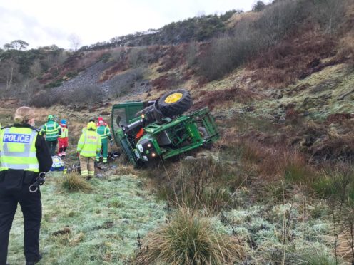 A man has been flown to hospital after a tractor crashed down an embankment near Fyvie