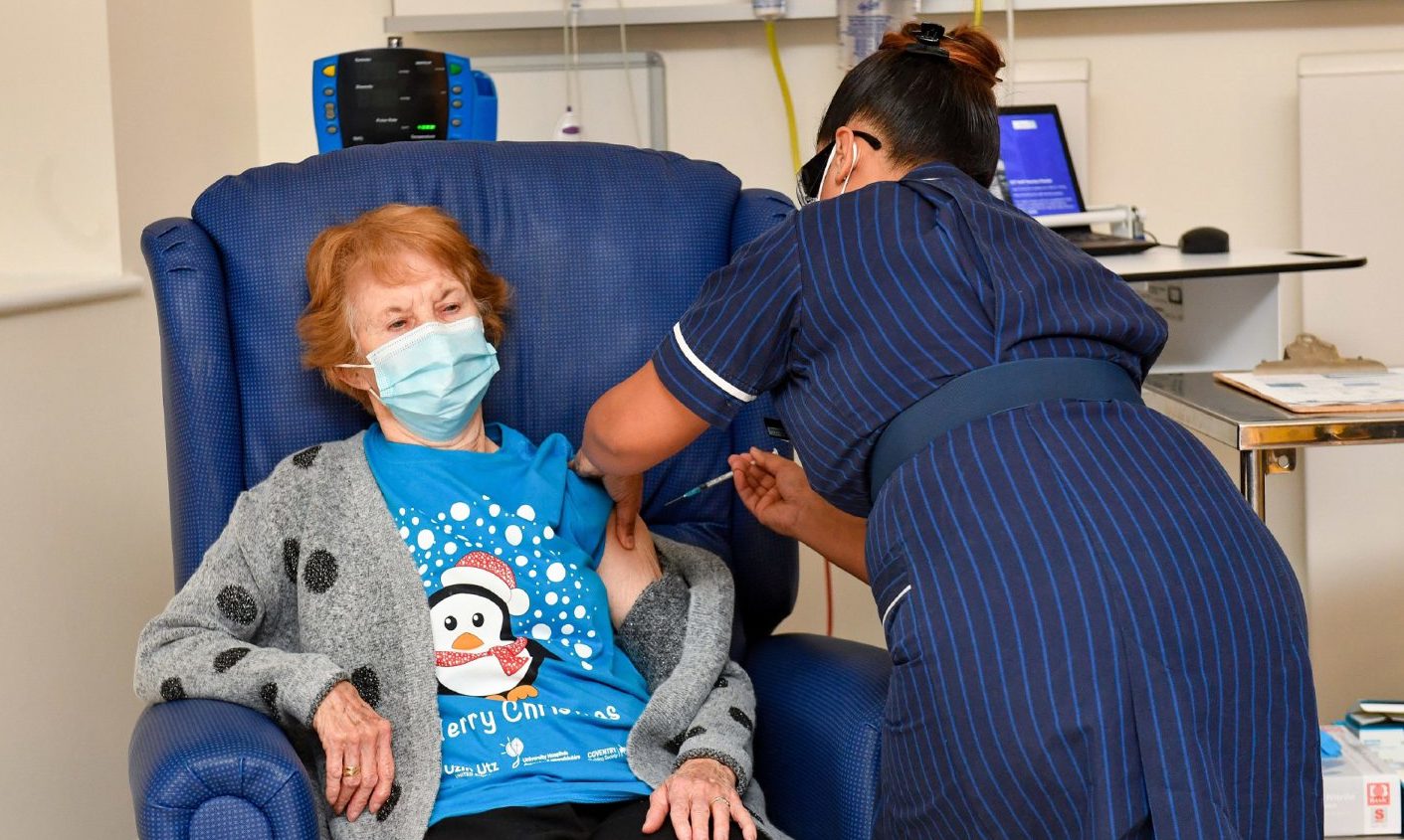 Margaret Keenan, 90, is the first patient in the United Kingdom to receive the Pfizer/BioNtech covid-19 vaccine at University Hospital, Coventry, administered by nurse May Parsons.