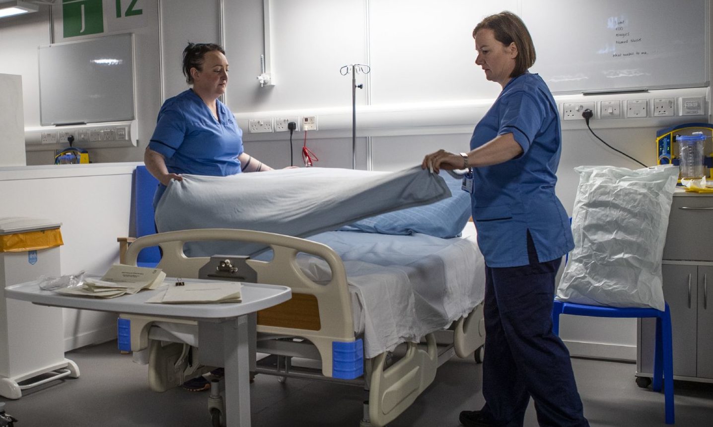 Nurses make final preparations during the completion of the construction of the NHS Louisa Jordan hospital in Glasgow.