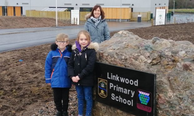 Linkwood Primary School head teacher Fiona Stevenson with P3 pupil William Forbes and P2 pupil Louise Buchan.